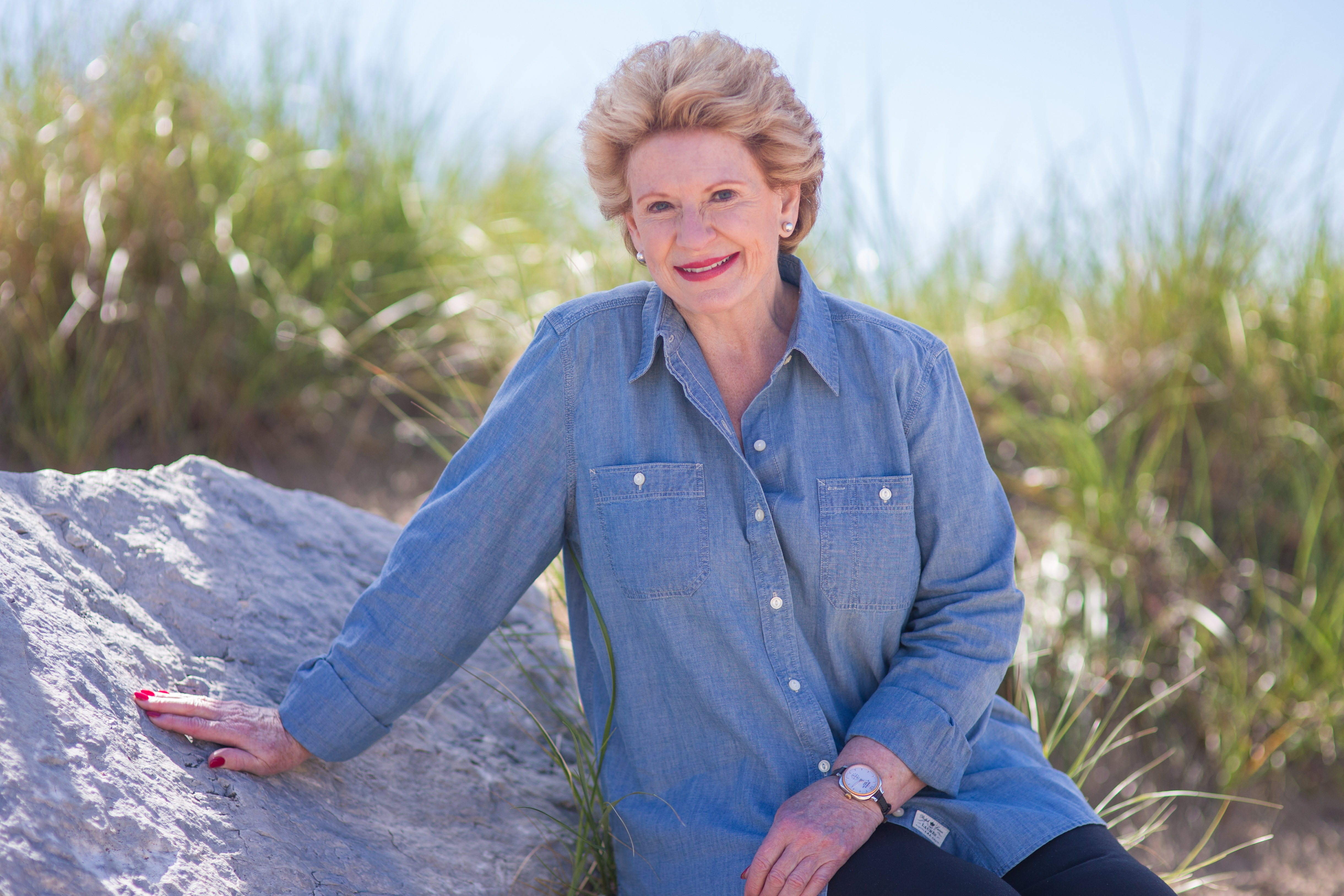 Senator Debbie Stabenow among some beach dunes
