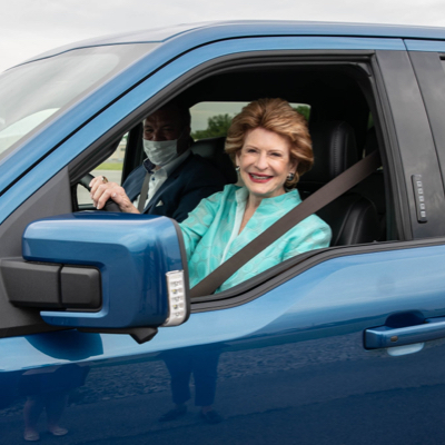 Senator Debbie Stabenow driving a truck